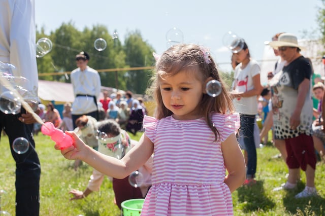 Girl playing with bubbles